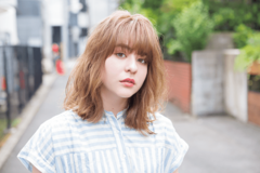 リバースに流れる重めバングで 小顔も可愛さも底上げ！